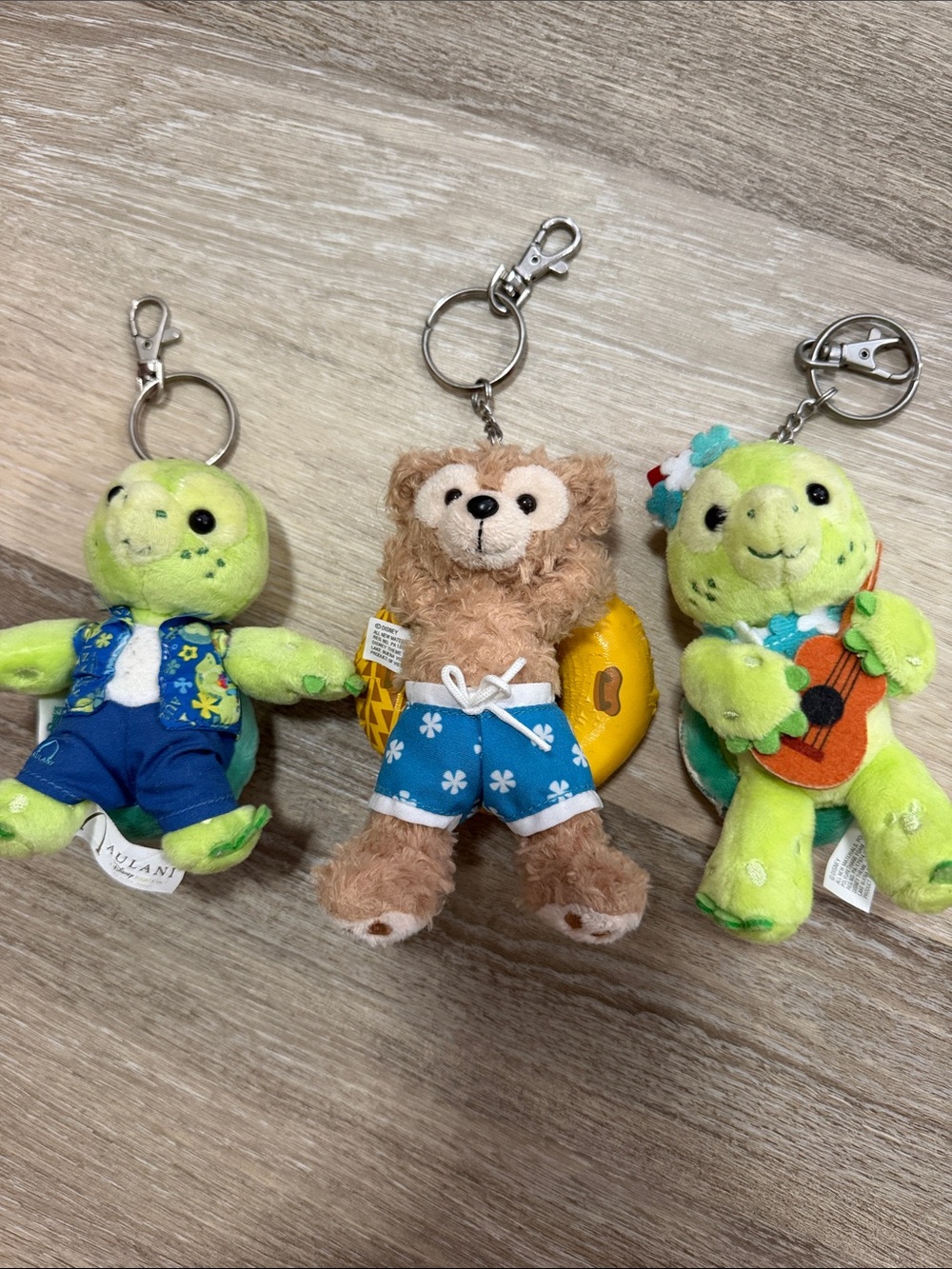Disney Aulani Plush Keychain Trio in Bright Green and Tan with Blue Outfits